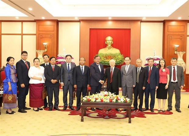 Le SG du Parti recoit le chef de la Commission des realtions exterieures du Parti du peuple cambodgien hinh anh 1
